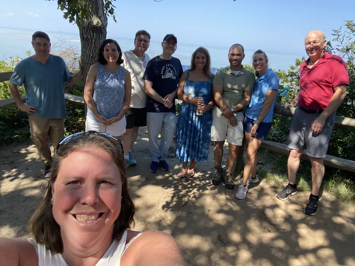 People standing at the end of the Eddy Bay Trail, overlooking Cape Cod Bay.