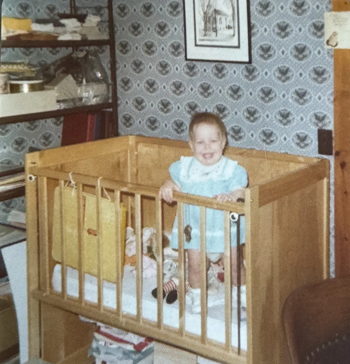 Sharon Linnell Kautz in a crib.