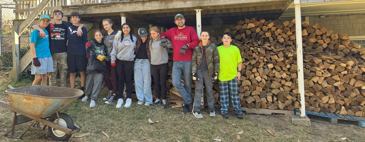 Student raking service project Students during leaf raking project